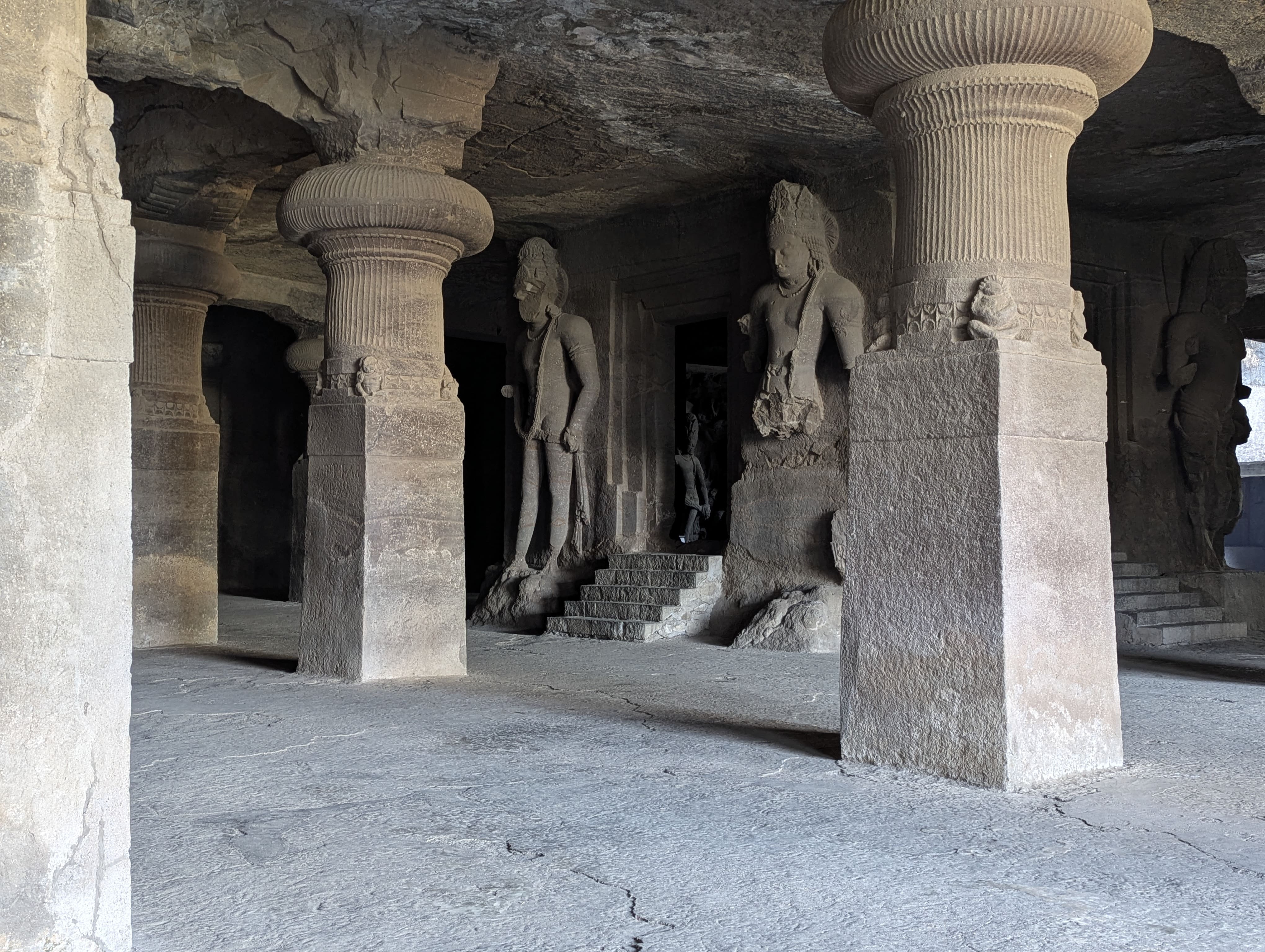 Ancient rock cut architecture inside Elephanta Caves on speedboat tour