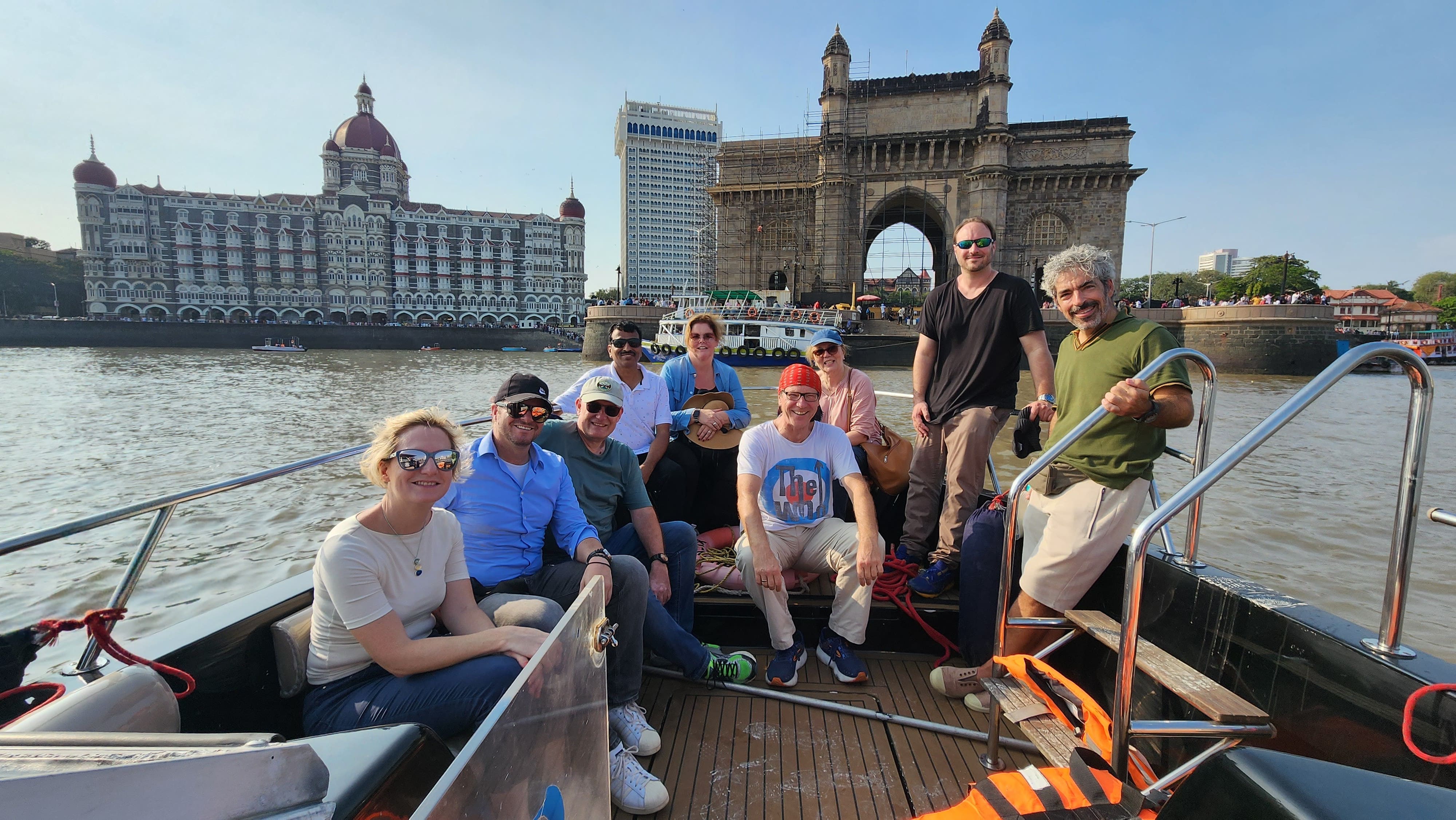 Small group of international travelers on a luxury speedboat near Gateway of India before visiting Elephanta Caves